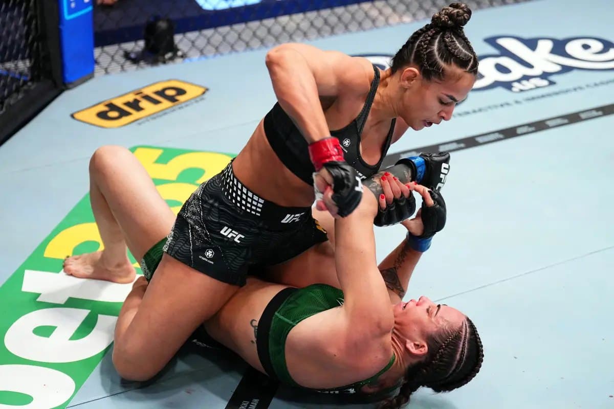 Bia Mesquita attacking from mount during a UFC bantamweight fight