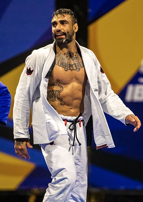 Leandro Lo competing in a white gi at the 2022 IBJJF World Championships